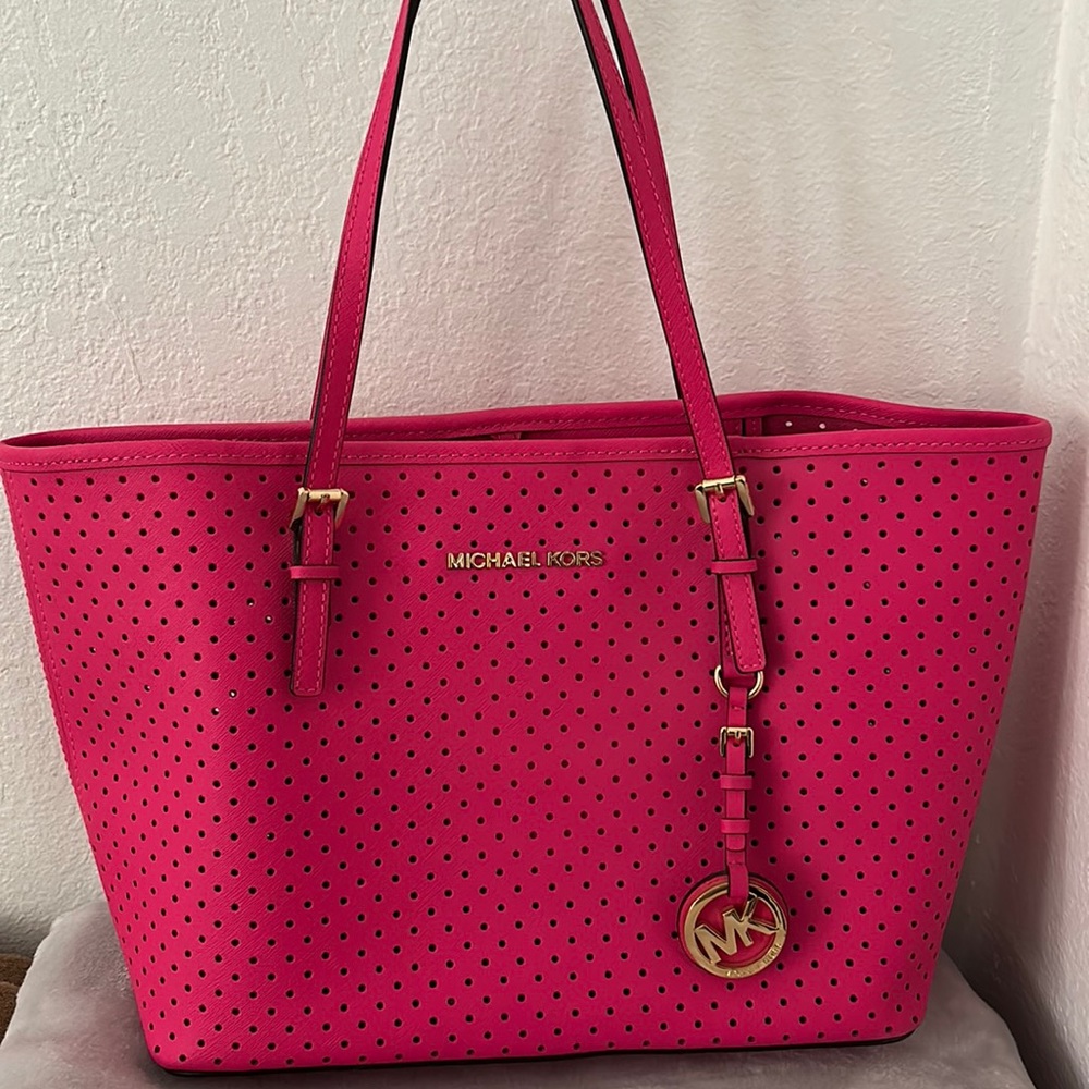 Pink purse with holes